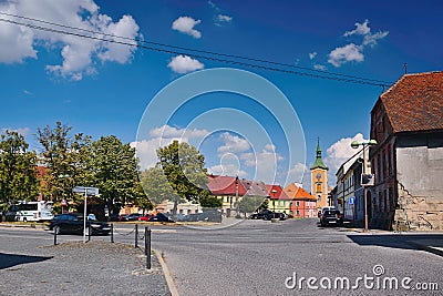 Kravare, Machuv kraj, Czech republic - July 14, 2018: intersection near the square with parked cars, historical houses and church Editorial Stock Photo