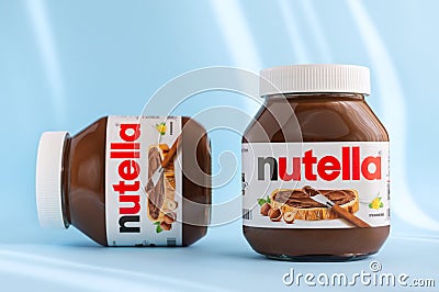 Two jars of nutella on a blue Editorial Stock Photo