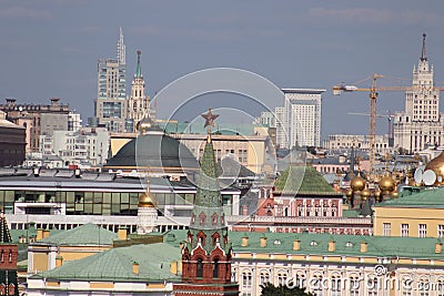 Kremlin tower with a star. Roofs of the Kremlin buildings. Temple domes, modern buildings. Editorial Stock Photo