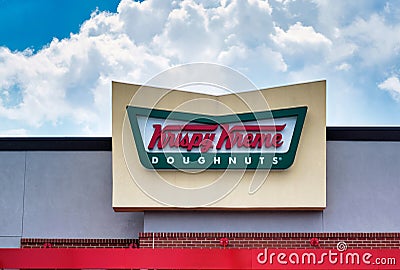 Krispy Kreme Doughnuts rooftop sign. Editorial Stock Photo