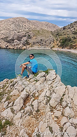 Krk - Young man and the bay Stock Photo