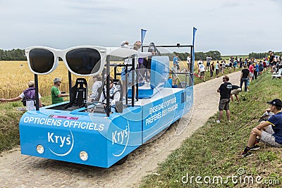 Krys Vehicle on a Cobblestone Road- Tour de France 2015 Editorial Stock Photo