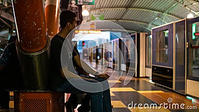 Unidentified boys waiting for the LRT train to stop at the Imbi station Editorial Stock Photo