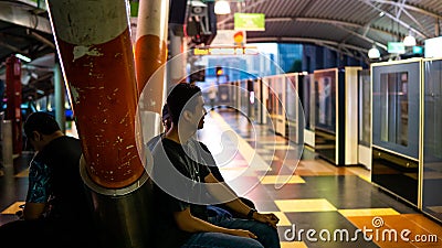 Unidentified boys waiting for the LRT train to stop at the Imbi station Editorial Stock Photo