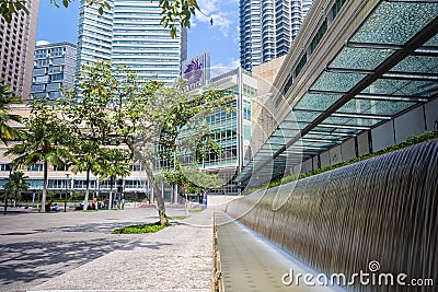 Kuala Lumpur, Malaysia - August 13, 2022: KLCC Park with the water fountain show in front of the Petronas towers. HDR Long Editorial Stock Photo