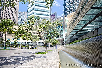 Kuala Lumpur, Malaysia - August 13, 2022: KLCC Park with the water fountain show in front of the Petronas towers. HDR Long Editorial Stock Photo