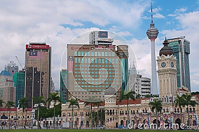 View to the Sultan Abdul Samad building with modern buildings at the background in Kuala Lumpur, Malaysia. Editorial Stock Photo