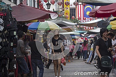 KUALA LUMPUR, MALAYSIA DEC 18TH: Petaling Street on Dec 18th 2012. In Chinatown the street is infamouse for pirated clothes and b Editorial Stock Photo