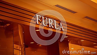 KUALA LUMPUR, MALAYSIA - DECEMBER 04, 2022: Furla brand retail shop logo signboard Editorial Stock Photo