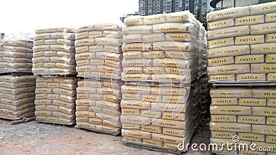 Stock pile of portland cement in commercial bags. Editorial Stock Photo