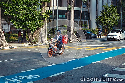 Local man on motorbike driving on central roads of the city Editorial Stock Photo