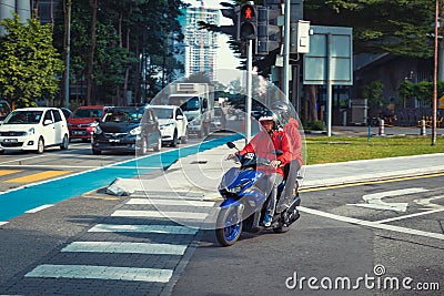 Local people on motorbike driving on central roads of the city Editorial Stock Photo