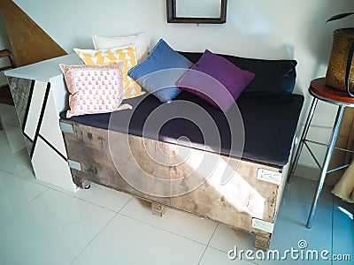Big cargo wooden crate upcycled into a sofa to match the industrial interior design in an Stock Photo