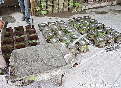 Preparation of concrete cube for concrete compression and strength test in the laboratory. Editorial Stock Photo