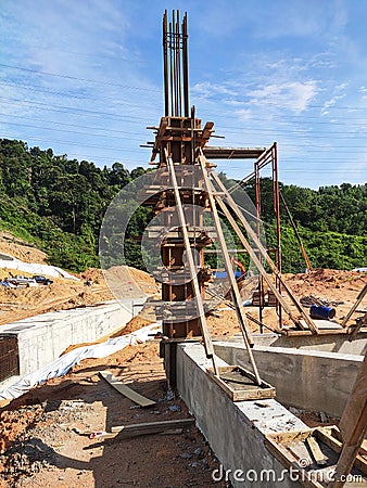 Column timber form work and reinforcement bar at the construction site. Editorial Stock Photo