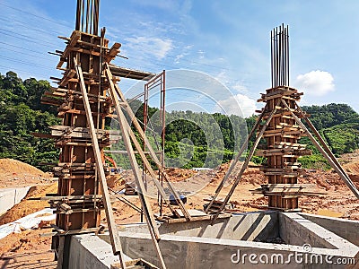 Column timber form work and reinforcement bar at the construction site. Editorial Stock Photo