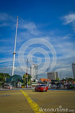 Kuala Lumpur, Malaysia - March 9, 2017: Malaysia flag waving tall in Merdaka Square, in the city downtown. Editorial Stock Photo