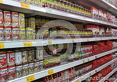 Processed can food are arranged on a supermarket shelf Editorial Stock Photo