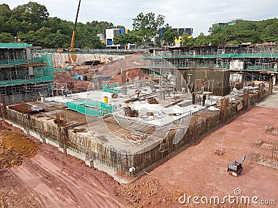Building substructure and super-structure under construction using the open-cut method. Editorial Stock Photo