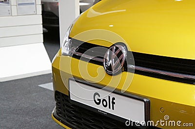 Volkswagen car manufacturer commercial emblem logos made from chrome metal fix at the car. Editorial Stock Photo