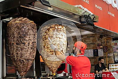 View of a chef preparing and making Traditional Turkish Doner Kebab meat. It also knowns as Shawarma. Editorial Stock Photo