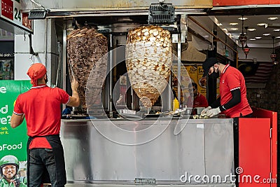 View of a chef preparing and making Traditional Turkish Doner Kebab meat. It also knowns as Shawarma. Editorial Stock Photo