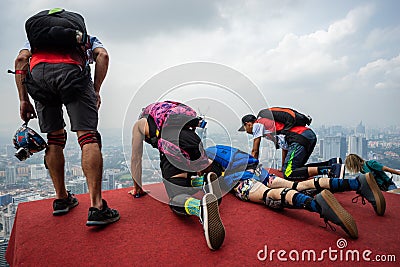 A BASE jumpers in jumps off from KL Tower. Editorial Stock Photo