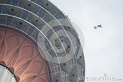 A BASE jumpers in jumps off from KL Tower. Editorial Stock Photo