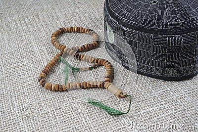 KUALA LUMPUR, 18 May 2016: The Holy Quran,Tasbih and kopiah hat. DOF and copy space Stock Photo