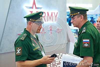 KUBINKA, RUSSIA, AUG.24, 2018: Two Russian army officers in green uniform talking to each other on International Military Technic Editorial Stock Photo