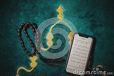 Muslim Pro apps on mobile phone Editorial Stock Photo