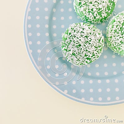 Three Kuih Lopes on a blue round plate. circular. Stock Photo