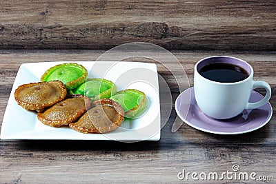 Kuih Pinjaram and a cup of coffee Stock Photo