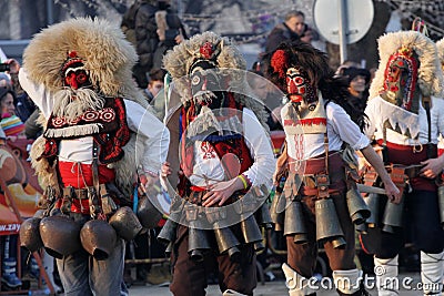 Kukeri, mummers perform rituals to scare away evil spirits during the international festival of masquerade games Editorial Stock Photo