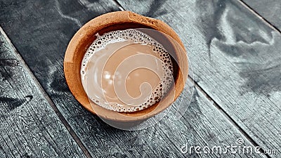 A kulhar or kulhad cup traditional handle-less clay cup from North India filled with hot Indian tea Stock Photo