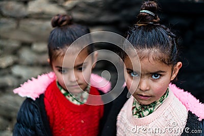 Kullu, Himachal Pradesh, India - December 21, 2018 : Photo of poor indian Twins girl child in mountains Editorial Stock Photo