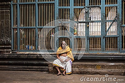 An aged priest sitting in a temple Editorial Stock Photo