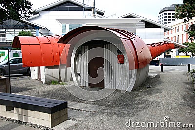 Red scaled and paneled facade in undulation of Kumutoto Toilet on Synergy Plaza on Queens Wharf, Wellington CBD, New Zealand Editorial Stock Photo