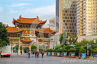 KUNMING-MARCH 15, 2015. Illuminated arches downtown, The golden horse gate in morning light. Kunming is the capital and largest Editorial Stock Photo