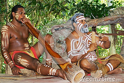 Aborigine actors perform music with traditional instruments in the Tjapukai Culture Park in Kuranda, Queensland, Australia. Editorial Stock Photo