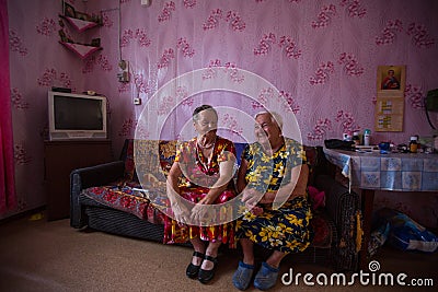Vepsian local women in them rural home. Editorial Stock Photo