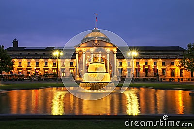 Kurhaus and Bowling Green in the evening with lights, Wiesbaden, Hesse, Germany Stock Photo