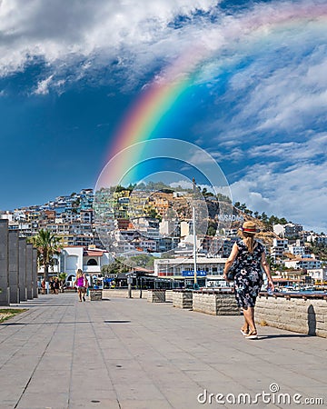 Kusadasi, Aydin, Turkey - August 22, 2021: Colorful Kusadasi houses on the hill with rainbow Editorial Stock Photo