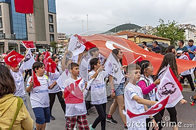 Kusadasi, Turkey, 05/19/2019: A celebration on the streets of the city. Happy people came out for a demonstration. Editorial Stock Photo