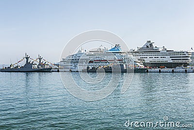 Kusadasi, Turkey, 05/19/2019: Large beautiful cruise ships stand in the port. Turquoise sea and clear blue sky on a sunny day. Editorial Stock Photo