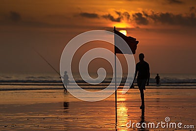 Beach flag at sunset , Kuta Beach, Bali, Indonesia Editorial Stock Photo