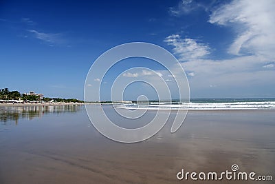 Kuta beach bali wet sand reflecting sky Stock Photo