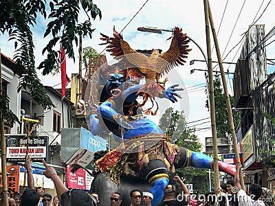 KUTA, INDONESIA - MARCH, 16, 2018: villagers moving an ogoh-ogoh statue for the new year parade at kuta on bali Editorial Stock Photo