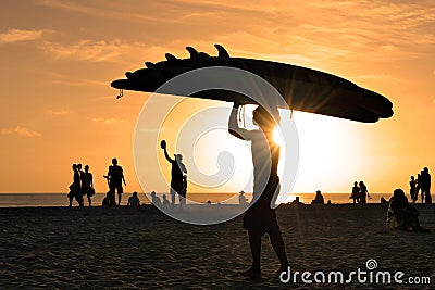 Kuta surf beach at sunset Stock Photo