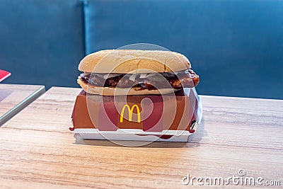 McDonald`s McRib sandwitch. McRib is a barbecue-flavored pork sandwich Editorial Stock Photo